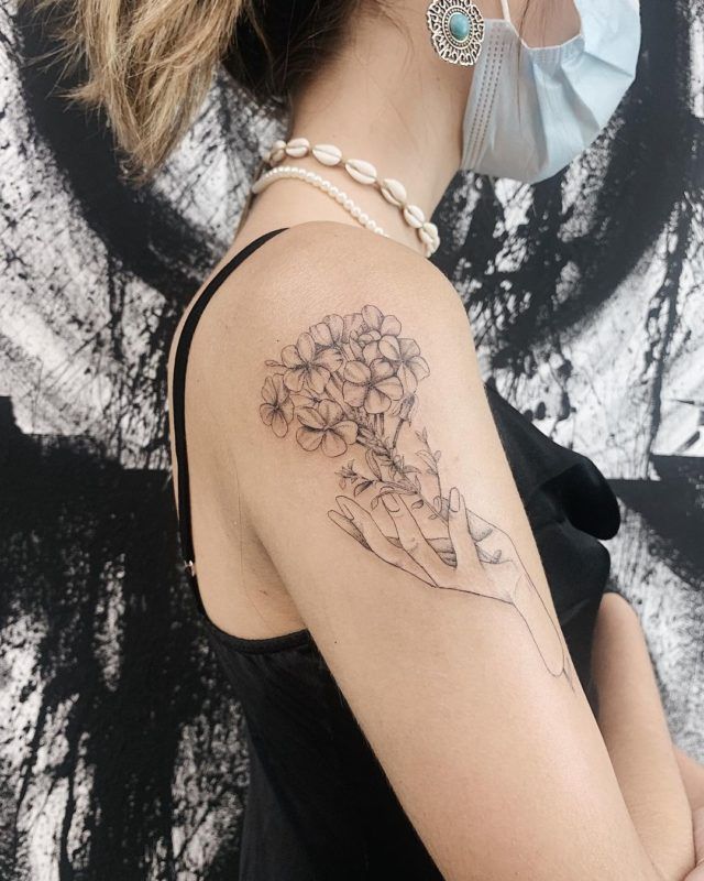 fine line flower tattoo